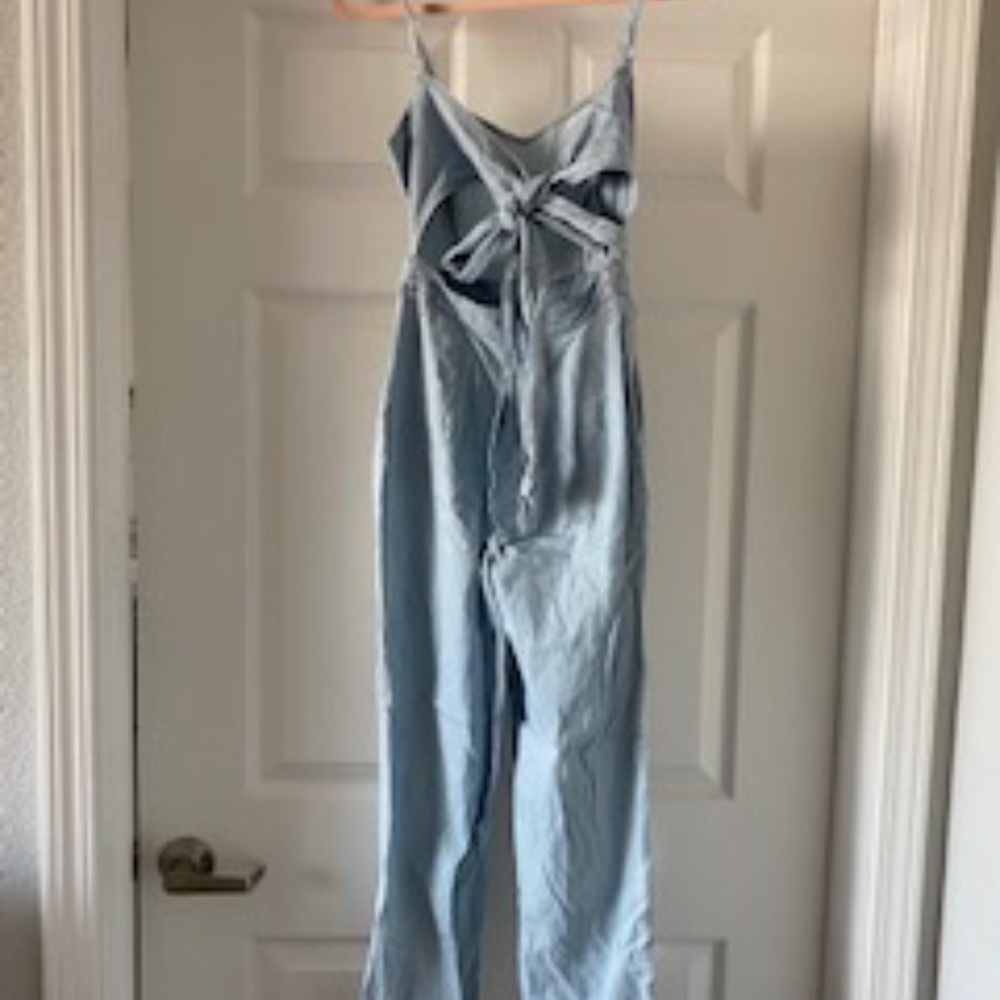 Express jean pantsuit with tie in the back.
